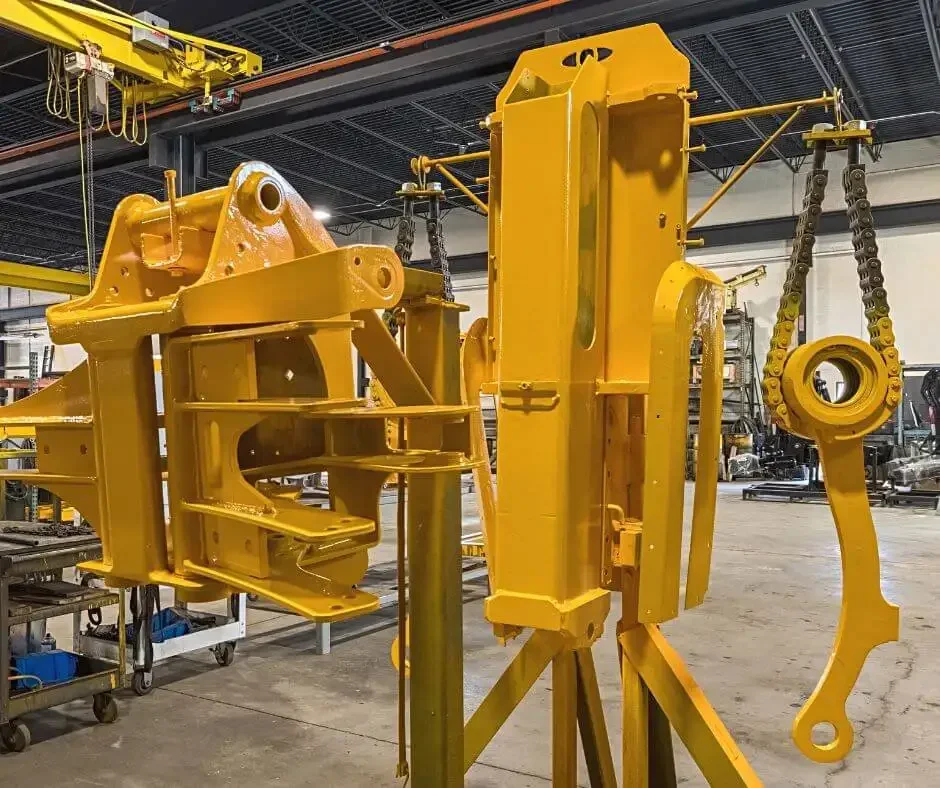 garbage truck arm getting refurbished by wastebuilt